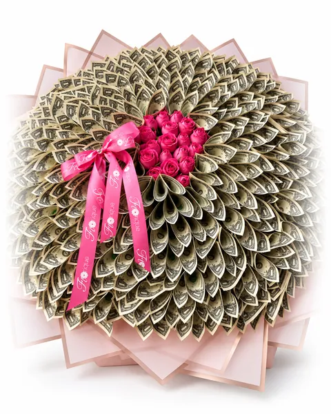 A round bouquet of folded notes with pink roses at the centre, tied with a pink Florique ribbon